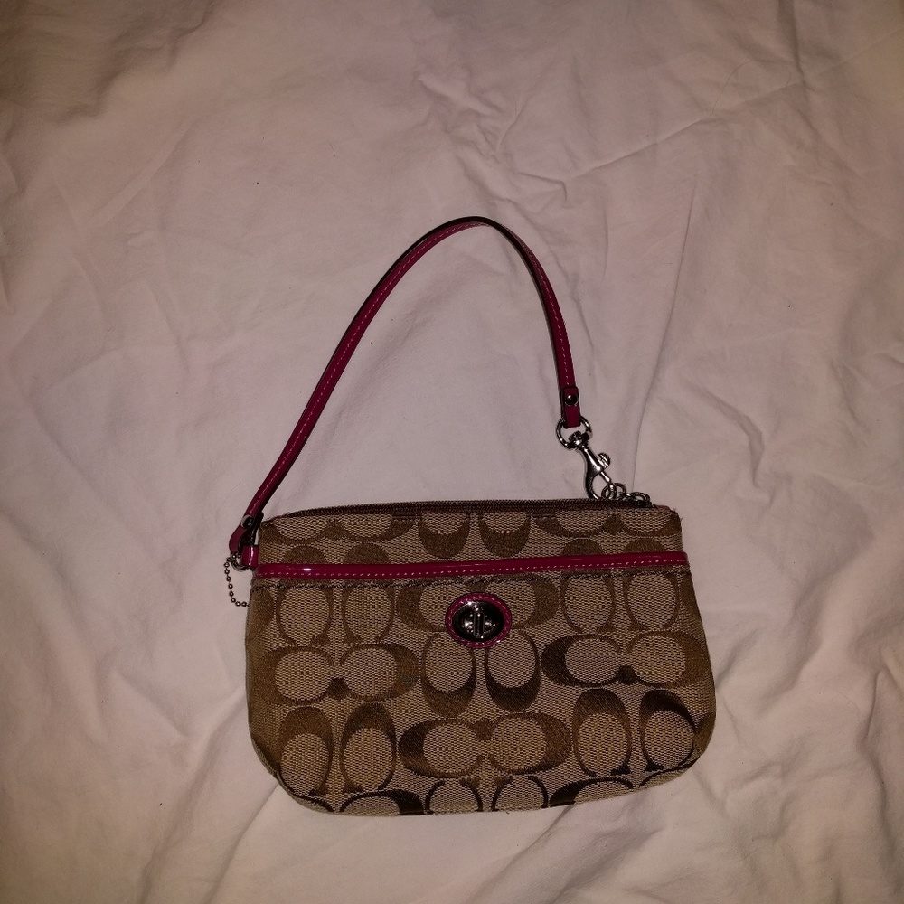 Brown and hot pink Coach wristlet. Great condition